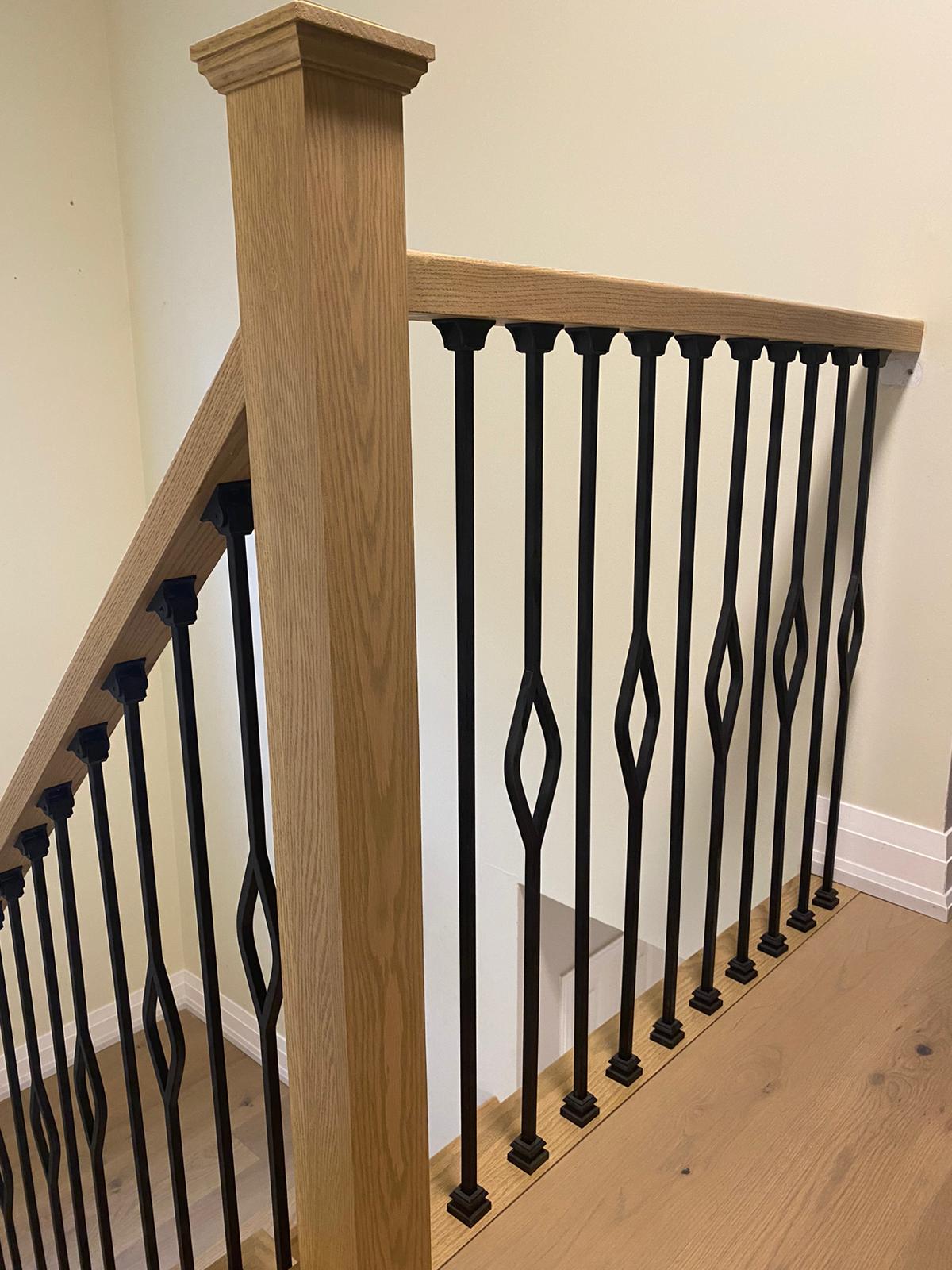 Oak Railing & Iron Balusters by Simply Stairs